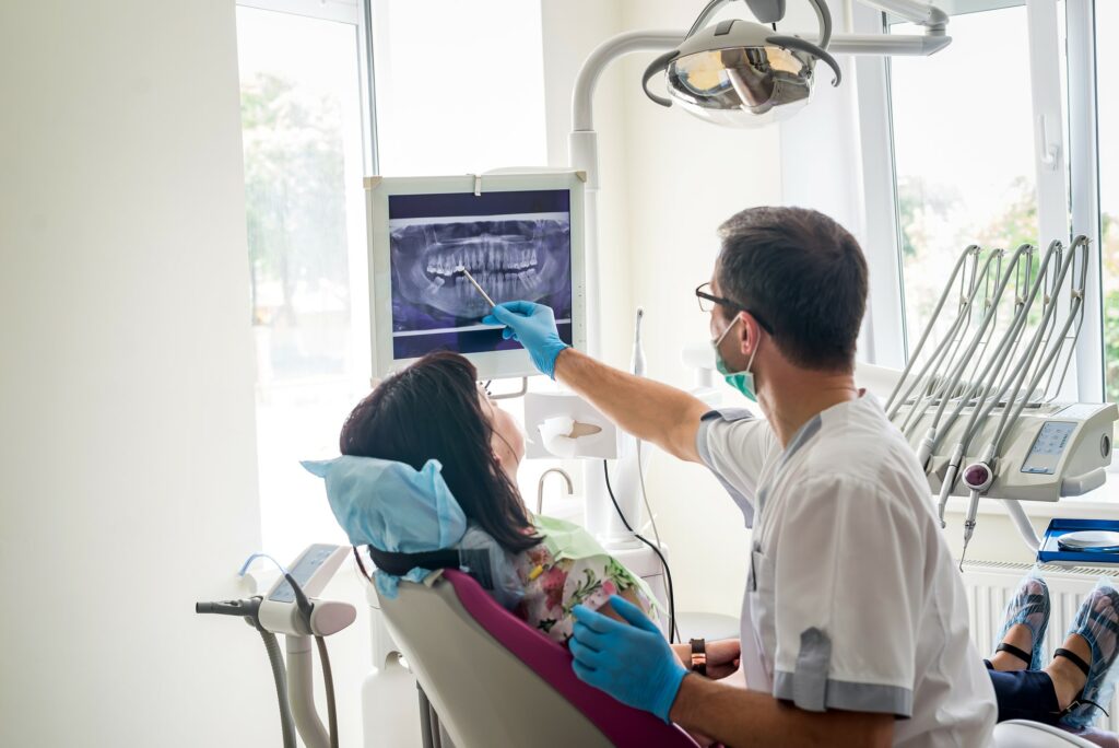 dentist showing patient xray